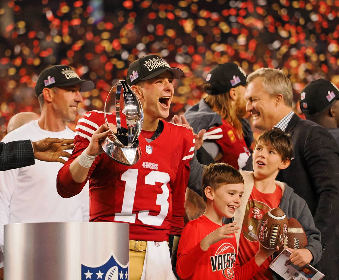 San Francisco 49ers quarterback Brock Purdy (13) holds the George Halas Trophy after winning the NFC Championship football game against the Detroit Lions at Levi’s Stadium on Sunday. Mr. Irrelevant will lead the 49ers into Super Bowl LVIII against the Kansas City Chiefs on Feb. 11.