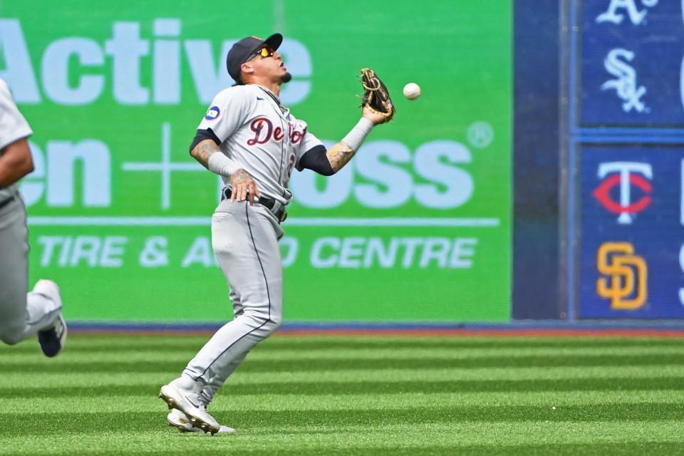 Tigers shortstop Javier Baez commits a fielding error allowing Blue Jays shortstop Bo Bichette (not shown) to reach first base in the fourth inning July 31, 2022 at Rogers Centre.