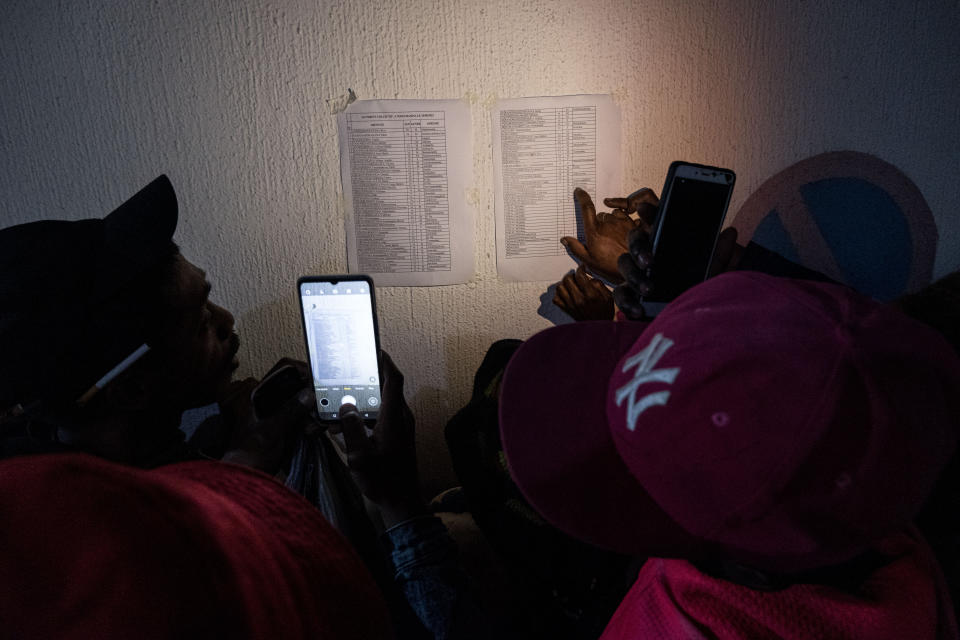 ANTANANARIVO, MADAGASCAR - AUGUST 25: People look for their relatives, who were injured and taken to a hospital, on a sheet of paper after a stampede of sports fans tried to enter Madagascar's national stadium for the opening ceremony of the Indian Ocean Island Games at Barea Mahamasina Stadium in Antananarivo, Madagascar on August 25, 2023. At least 12 people were killed and 80 injured in the stampede. (Photo by Rafalia Henitsoa/Anadolu Agency via Getty Images)