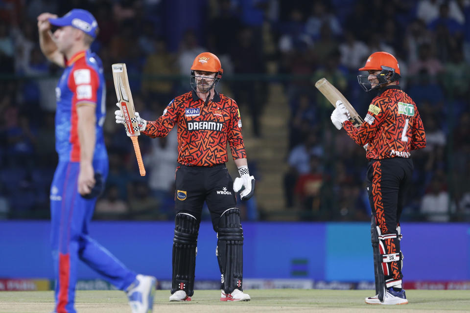 Sunrisers Hyderabad's Travis Head, second right, celebrates scoring fifty runs as Abhishek Sharma watches during the Indian Premier League cricket match between Delhi Capitals and Sunrisers Hyderabad in New Delhi, India, Saturday, April 20, 2024. (AP Photo/Surjeet Yadav)