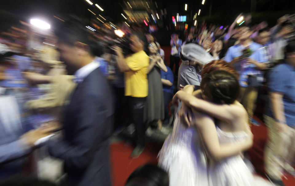 Taiwanese same-sex couples kiss at their wedding party in Taipei, Taiwan, Saturday, May 25, 2019. Taiwan became the first place in Asia to allow same-sex marriage last week. Hundreds of same-sex couples in Taiwan rushed to get married Friday, the first day a landmark decision that legalized same-sex marriage took effect. (AP Photo/Chiang Ying-ying)