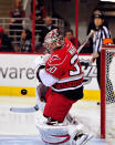 RALEIGH, NC - JANUARY 14: Goalkeeper Cam Ward #30 of the Carolina Hurricanes bobbles the puck as he stops a shot by the Boston Bruins during play at the RBC Center on January 14, 2012 in Raleigh, North Carolina. (Photo by Grant Halverson/Getty Images)