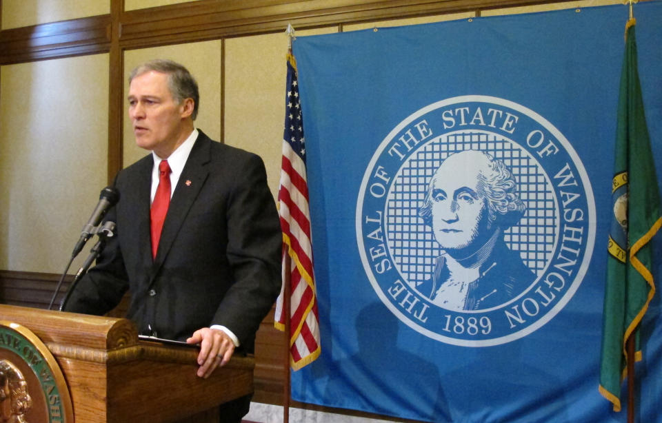 Gov. Jay Inslee announces Tuesday, Feb. 11, 2014, that he is suspending the use of the death penalty in Washington state during a news conference in Olympia, Wash. Inslee's moratorium, which will be in place for as long as he is governor, means that if a death penalty case comes to his desk, he will issue a reprieve, which isn't a pardon and doesn't commute the sentences of those condemned to death. (AP Photo/Rachel La Corte)