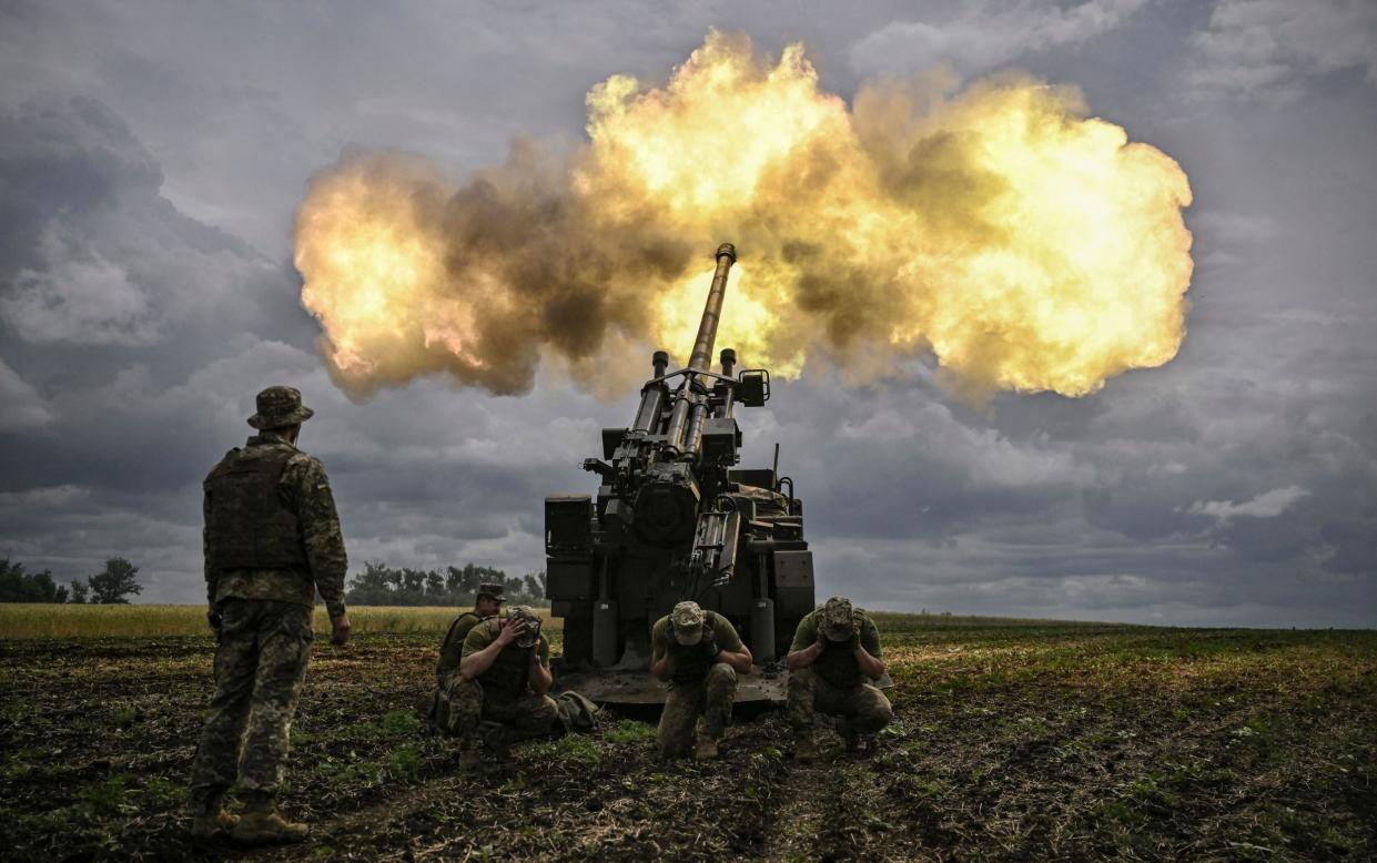 Ukrainian servicemen fire on Russian positions in the Donbas - GETTY IMAGES