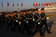 Paramilitary police officers walk in formation on Tiananmen Square ahead of the opening session of the Chinese People's Political Consultative Conference (CPPCC) in Beijing, China March 2, 2017. REUTERS/Thomas Peter