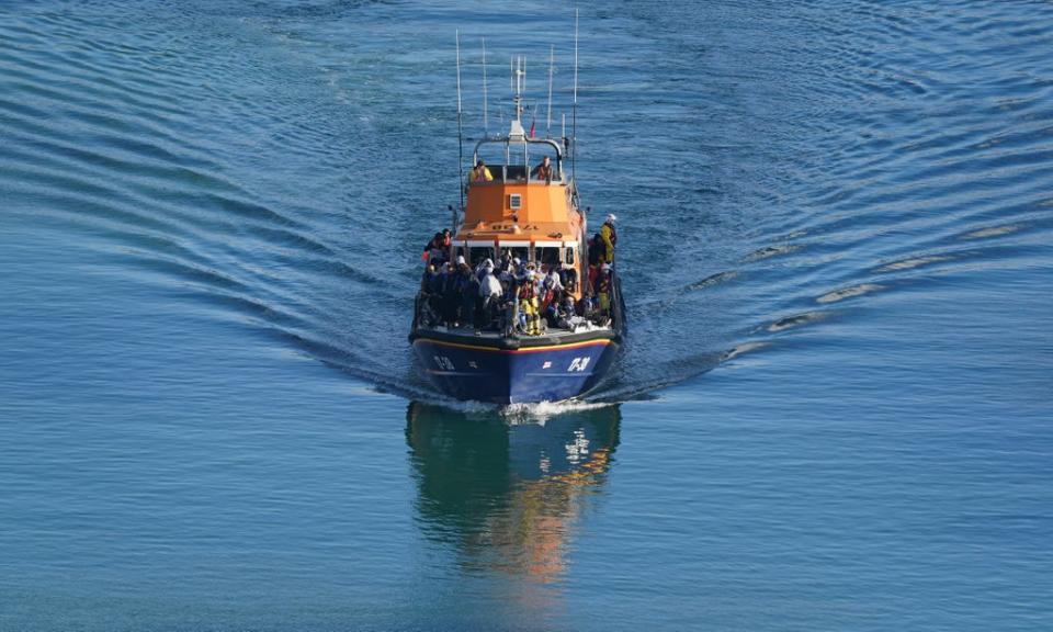 A group of people thought to be migrants are brought into Dover, Kent (Gareth Fuller/PA) (PA Wire)