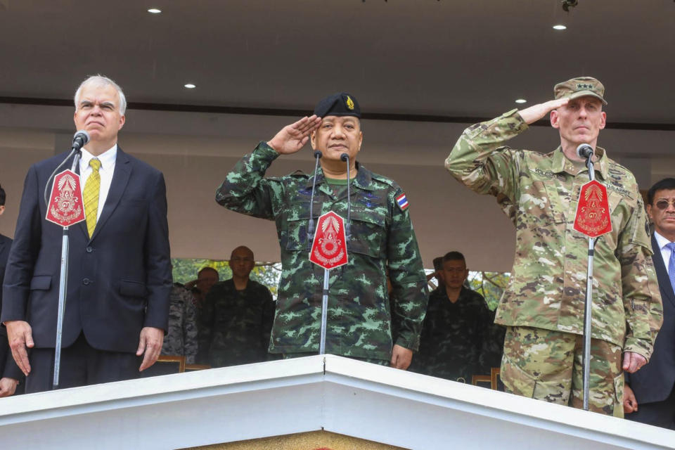 In this photo by release Royal Thai Armed Forced Headquarters, from left; acting U.S. ambassador Peter Haymond, The Royal Thai Armed Forces, Gen. Pornpipat Benyasri, Commander, and U.S. Army First Corps representing U.S. Indo-Pacific Command Lt. Gen. Gary J. Volesky salute during the opening ceremony of the joint military exercise Cobra Gold 2019, Phitsanulok Province, Thailand. Tuesday, Feb. 12, 2019. The exercise will take place from Feb. 12-22 focusing on military Field Training Exercise, Humanitarian Civic Assistance to communities and Humanitarian Assistance and Disaster Relief Exercise. (Royal Thai Armed Forced Headquarters via AP)