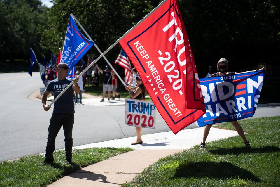 Republican and Democratic supporters protest as US President Donald Trump visits the Trump National Golf Club on September 5, 2020, in Sterling, Virginia. (Photo by BRENDAN SMIALOWSKI/AFP via Getty Images)