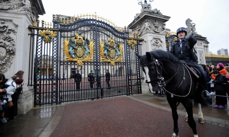 Armed and mounted police outside Buckingham Palace during the changing of the guard.