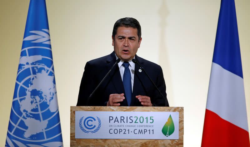 FILE PHOTO: Honduran President Hernandez Alvarado delivers a speech for the opening day of the World Climate Change Conference 2015 (COP21) at Le Bourget, near Paris