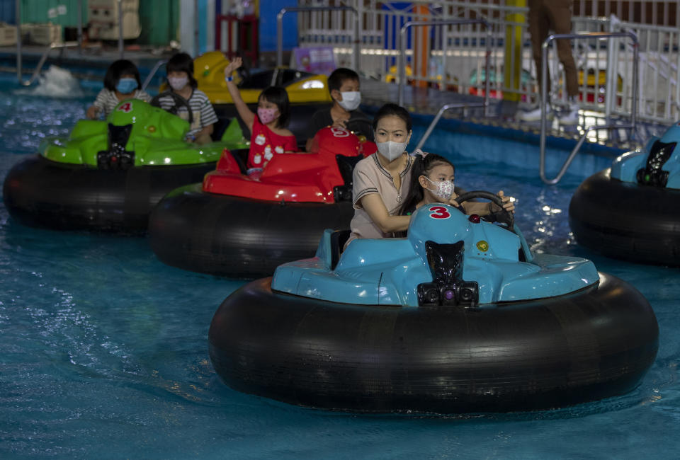 Visitors enjoy themselves at Yoyo Land, an indoor amusement center in Bangkok, Thailand, Tuesday, June 16, 2020. Thailand’s Cabinet has approved three projects with a combined budget of more than 22 billion baht ($707 million) to help the country’s reeling tourism industry recover from the coronavirus crisis. (AP Photo/ Gemunu Amarasinghe)