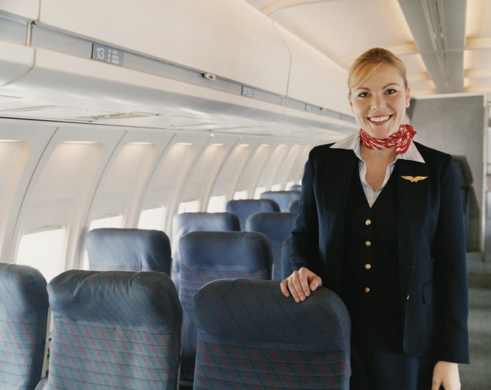 Here's what the flight attendants are really talking about over the loudspeaker. Photo:Getty Images.