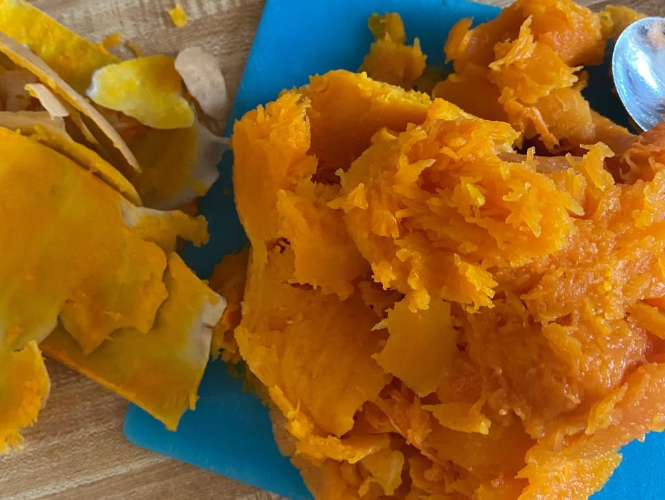 A pile of squash next to its peel