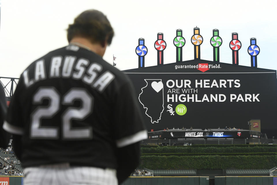 Chicago White Sox manager Tony La Russa bows his head during a moment of silence for the victims of the Highland Park, Ill., Fourth of July parade shootings, before a baseball game between the Chicago White Sox and the Minnesota Twins on Tuesday, July 5, 2022, in Chicago. (AP Photo/Paul Beaty)