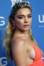 <p>Florence Pugh's voluminous waves are pulled and tied to the back, with some key volume at the crown. She adds a small braid cascading down for some added bohemian style. </p>