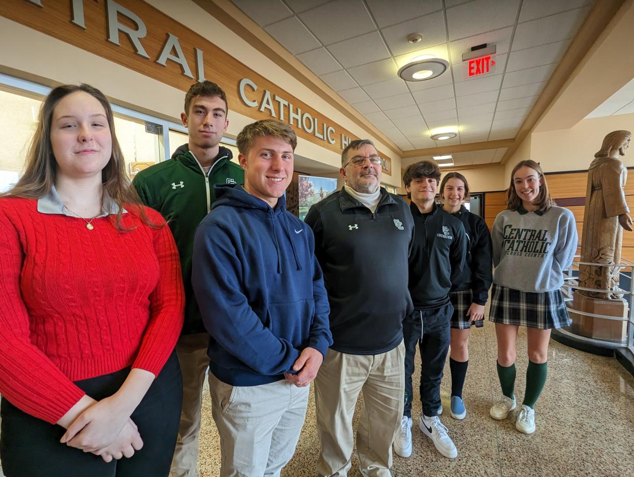 Gerald Hudnall, center, a teacher at Central Catholic High School, offers one of the few Holocaust classes offered in Stark County area schools. With him are some of his students (left to right, front) Alyssa Schoolcraft, Ryan Turner, Dominic DePasquale, Brigid Burke, Grace Bentzel and Dylan Rouse (back row)