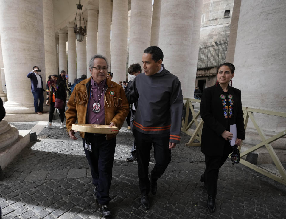 FILE - from left, Gerald Antoine, First Nations NWT Regional Chief, Natan Obed, President of Inuit Tapiriit Kanatami delegation, and Cassidy Caron, President of the Metis community, walk in St. Peter's Square, at the Vatican, after their meeting with Pope Francis, Friday, April 1, 2022. The restitution of Indigenous and colonial-era artifacts, a pressing debate for museums and national collections across Europe, is one of the many agenda items awaiting Francis on his trip to Canada, which begins Sunday. (AP Photo/Alessandra Tarantino, File)