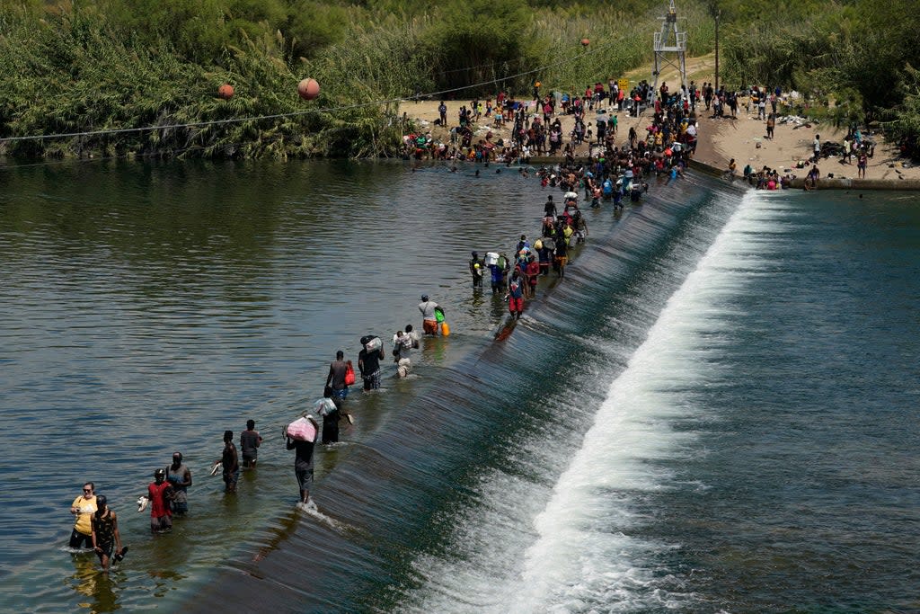 Migrants attempting to cross the Texas border  (Associated Press)