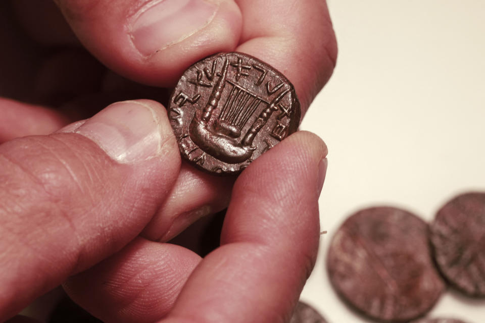 Ancient coins from the Bar Kochba Revolt period dating back to 132-136 AD, that were unearthed from an area in the Judean Desert. (Photo: MENAHEM KAHANA via Getty Images)