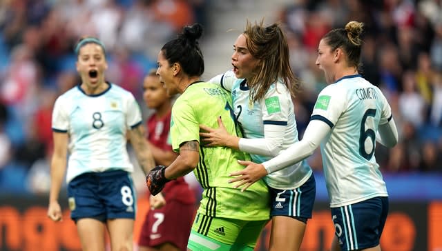 Vanina Correa, centre, celebrates after saving the penalty against England