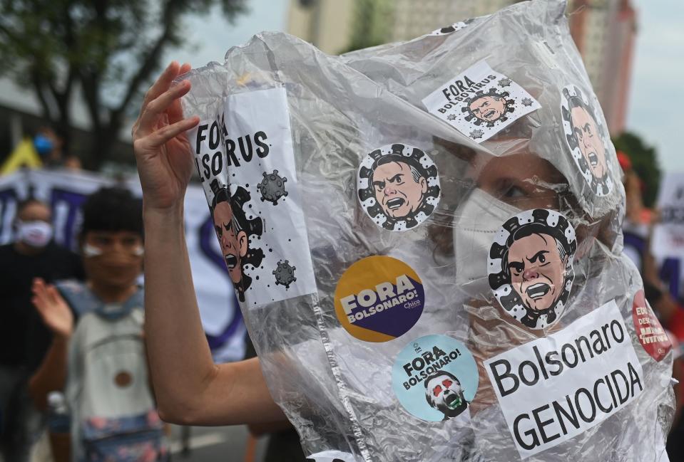 A demonstrator takes part in a protest against Brazilian President Jair Bolsonaro&#39;s handling of the Covid-19 pandemic in Rio de Janeiro (AFP via Getty Images)