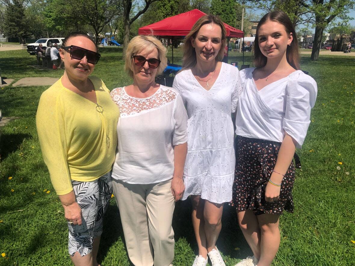 Volunteer Margaret Reznikof along with Ukrainian refugees Mariia Danyliuk, Tatiana Chorna and Anastasia Chorna who arrived in Windsor, Ont. less than a week ago after fleeing their home in Mykolaiv, in southern Ukraine. (Jacob Barker/CBC - image credit)