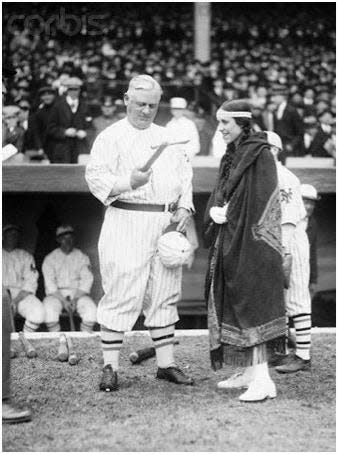 Baseball's Opening Day April, 1922 in New York. Princess Wah-Letka presents Giants Manager John McGraw with a tomahawk.