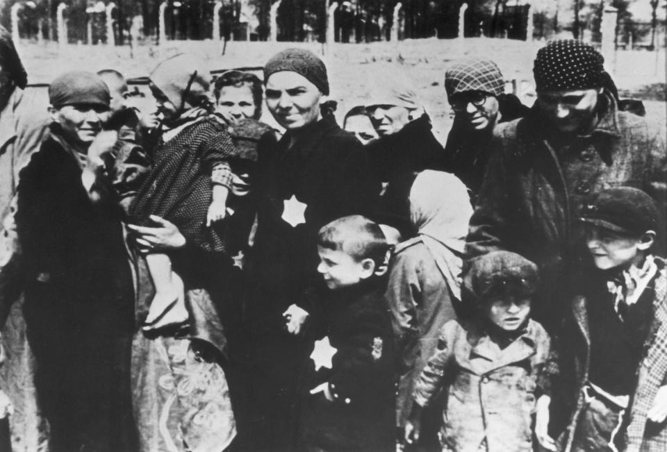 <span class="caption">Jewish women and children, some wearing the yellow Star of David patch on their chests, undergoing ‘selections’ at Auschwitz circa 1943.</span> <span class="attribution"><a class="link " href="https://www.gettyimages.com/detail/news-photo/jewish-women-and-children-some-wearing-the-yellow-star-of-news-photo/3240826?adppopup=true" rel="nofollow noopener" target="_blank" data-ylk="slk:Hulton Archive/Getty Images;elm:context_link;itc:0;sec:content-canvas">Hulton Archive/Getty Images</a></span>