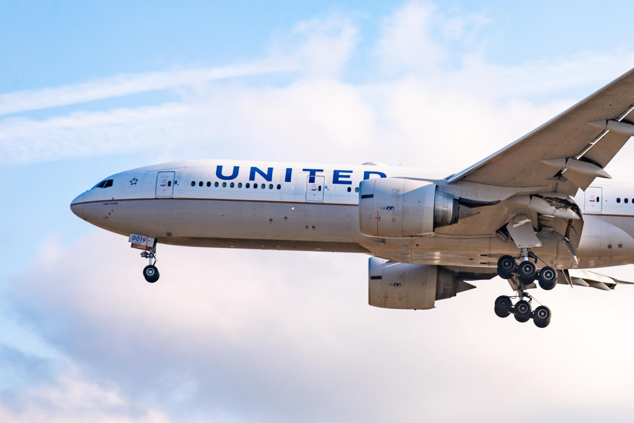 United Airlines Boeing 777-200 aircraft landing at London Heathrow International Airport in England, UK on 2 August 2019 during a summer day. The airplane has the registration N77019, has 2x GE90 engines and the name Larry Kellner. United Airlines UA UAL is a Star Alliance aviation alliance member. The carrier connects London to Chicago O'Hare, Houston Intercontinental, Los Angeles, Newark, San Francisco, Washington Dulles, Denver. The airliner is photographed from the famous plane spotting location Myrtle Avenue while it is landing on runway 27L. (Photo by Nicolas Economou/NurPhoto via Getty Images)