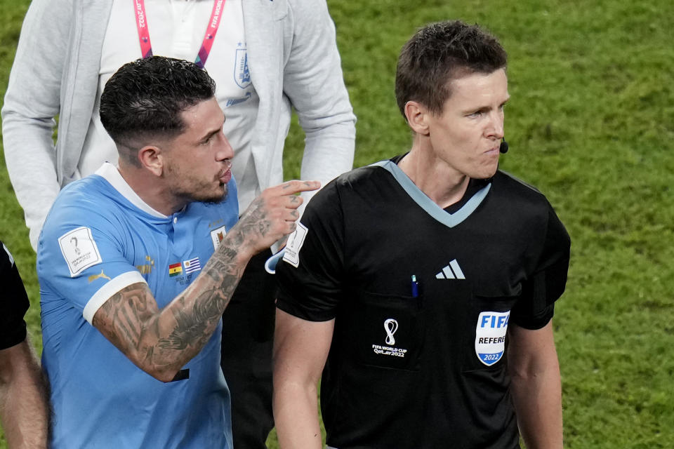 Uruguay's Jose Gimenez gestures to the German referee Daniel Siebert at the end of the World Cup group H soccer match between Ghana and Uruguay, at the Al Janoub Stadium in Al Wakrah, Qatar, Friday, Dec. 2, 2022. (AP Photo/Aijaz Rahi)