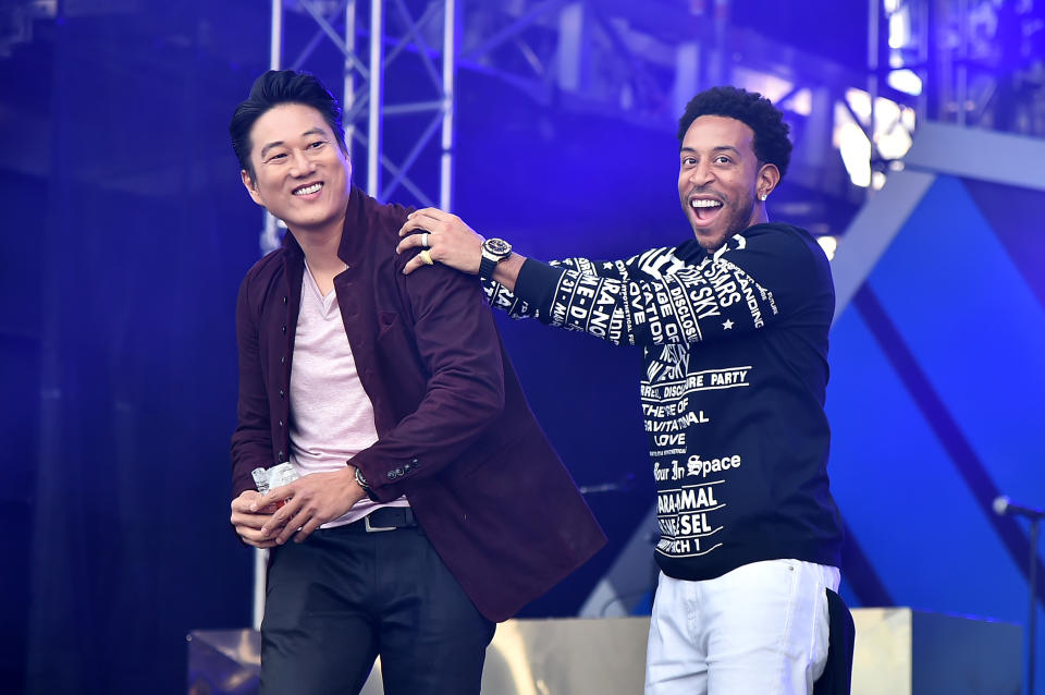 MIAMI, FLORIDA - JANUARY 31: Sung Kang and Ludacris speak onstage during Universal Pictures Presents The Road To F9 Concert and Trailer Drop on January 31, 2020 in Miami, Florida. (Photo by Theo Wargo/Getty Images for Universal Pictures)