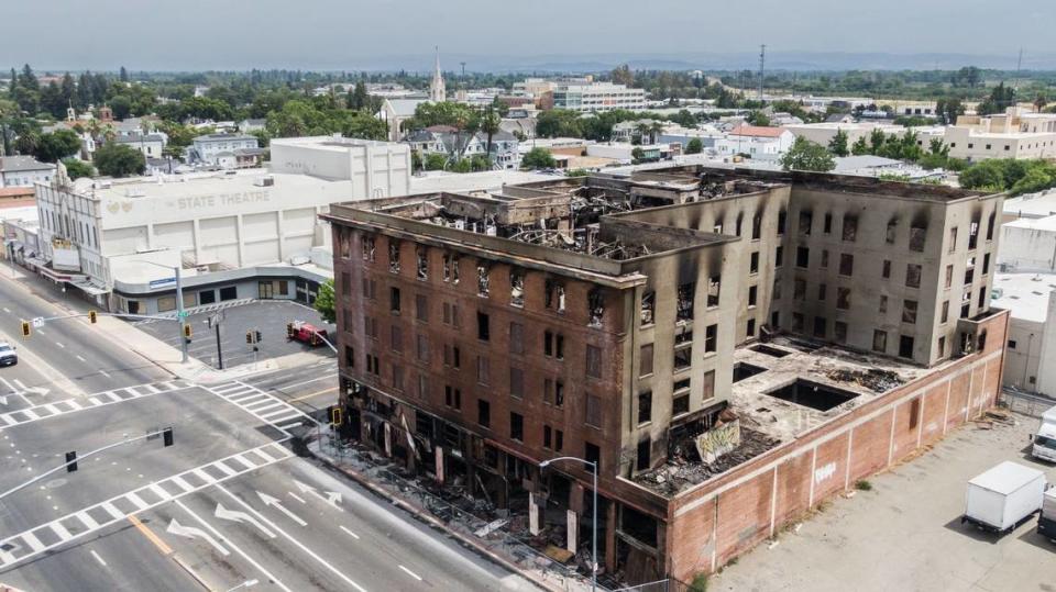 The burned historic Hotel Marysville stands in the city's downtown on June 20, days after it burned. Caltrans shut down Highway 70 and city leaders have declared a local state of emergency to address the dangerously compromised structure sitting in the center of town.