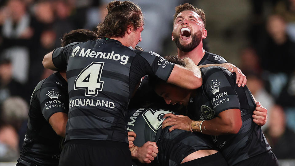 South Sydney Rabbitohs players celebrate victory over Penrith.