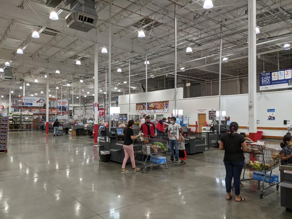 Customers line up at check-out area at Costco.