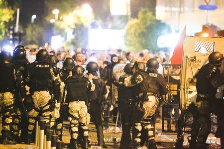 Macedonian riot police block the road near the parliament in Skopje. Macedonia April 27, 2017. REUTERS/Ognen Teofilovski