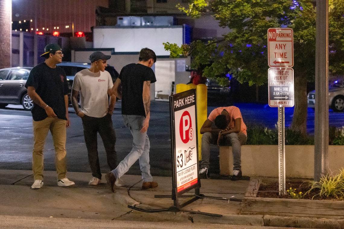 Club-goers mill around Glenwood Avenue at around 2:30 a.m. after business stoped serving alcohol in the Glenwood South district on Friday, July 21, 2023.