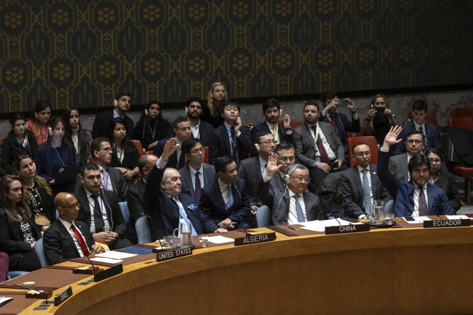 Representatives of member countries take votes during a Security Council meeting at United Nations headquarters, Thursday, April 18, 2024. (AP Photo/Yuki Iwamura)