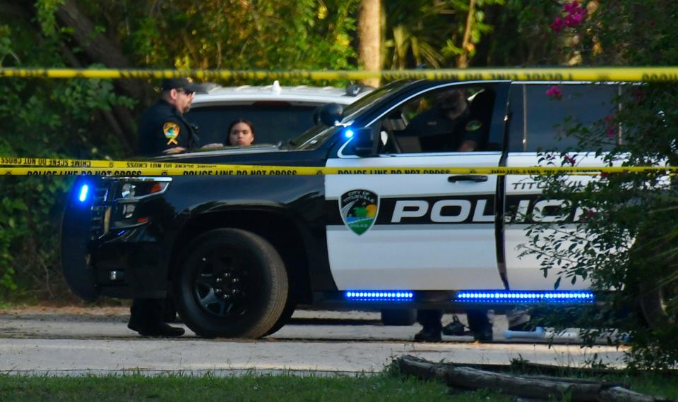 Titusville Police, detectives, and the Brevard Sheriffs Office on the scene of a double homicide in Titusville on Monday. The area around Sandalwood Apartments off of Knox McRae Drive was taped off, as two male victims were found shot to death.