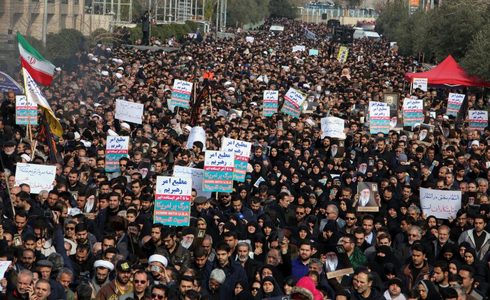 Iranians hold anti-U.S. banners during a demonstration in the capital Tehran on Jan. 3, following the killing of Iranian Revolutionary Guards Major General Qassem Soleimani in a U.S. strike on his convoy at Baghdad International Airport. (Photo: ATTA KENARE via Getty Images)