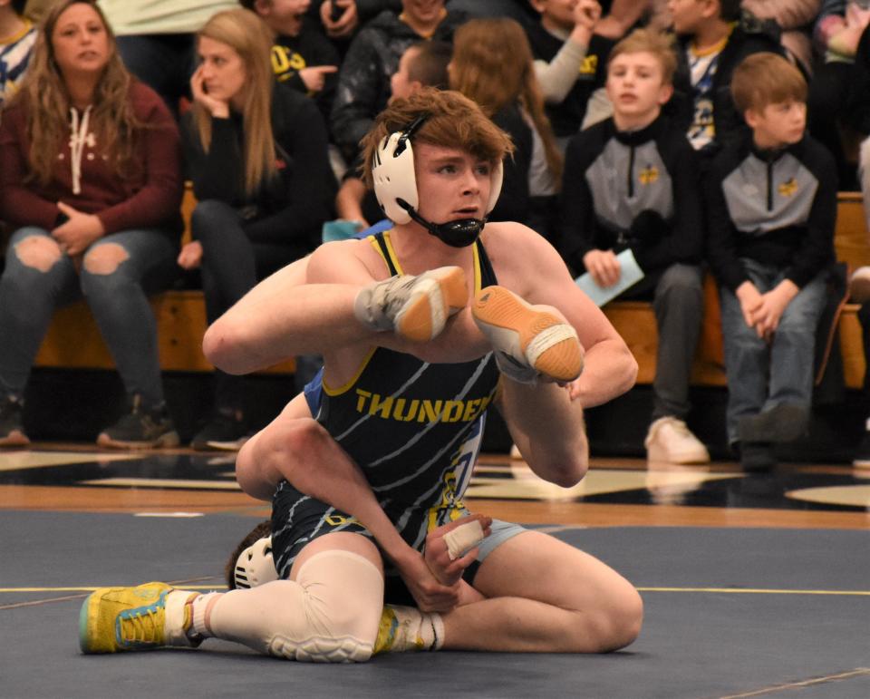 Central Valley Academy's Aden Mead tries to work free of Camden Blue Devil Bradley Reader's grasp Wednesday. Mead won a 7-2 decision at pounds at the teams' dual.