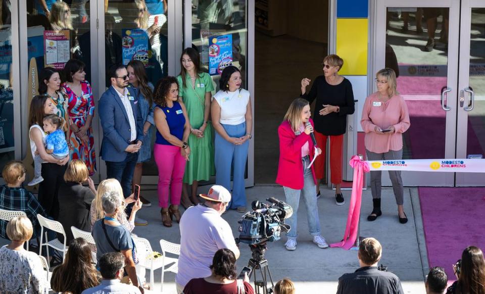 CEO Chelsie Webster, middle right, welcomes guests at the grand opening celebration of the Modesto Children’s Museum in Modesto, Calif., Thursday, Sept. 28, 2023.
