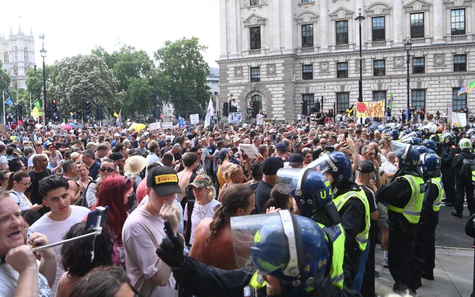 Anti-lockdown protesters at Parliament Square in July 2021 - Shutterstock