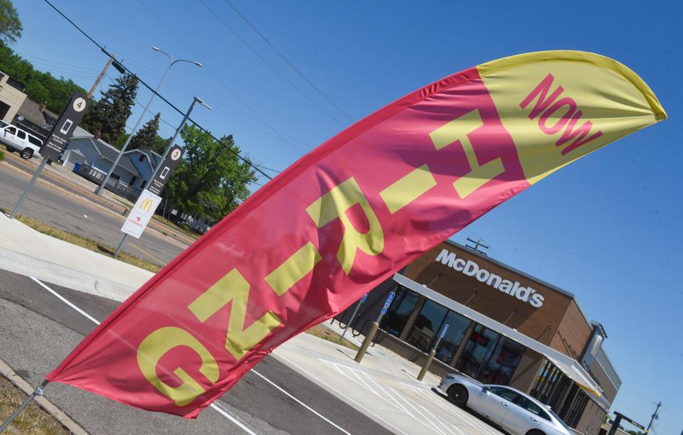 A now hiring flag flys outside of McDonalds on Division St Monday, June 14, 2021, in St. Cloud. 