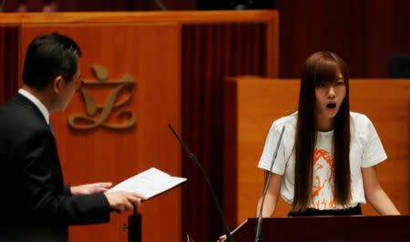 Newly elected lawmaker Yau Wai-ching takes oath at the Legislative Council in Hong Kong, China October 12, 2016. REUTERS/Bobby Yip
