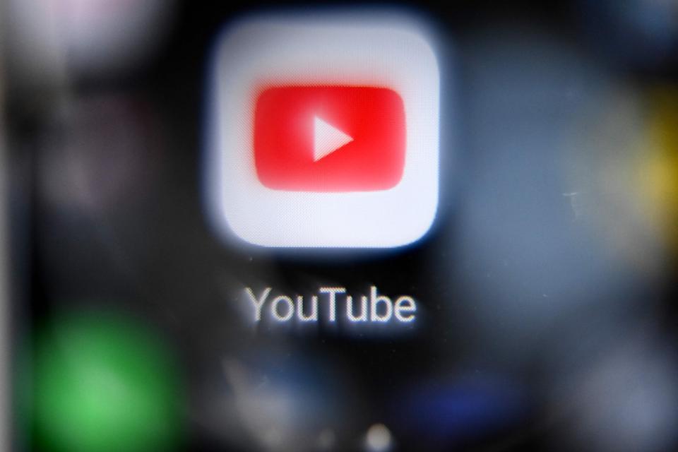 This file photo taken on October 12, 2021, shows the Youtube logo on a smartphone screen in Moscow, Russia. Google announced Tuesday that it's blocking the YouTube channels of Russian-state media outlets in Europe "effective immediately."