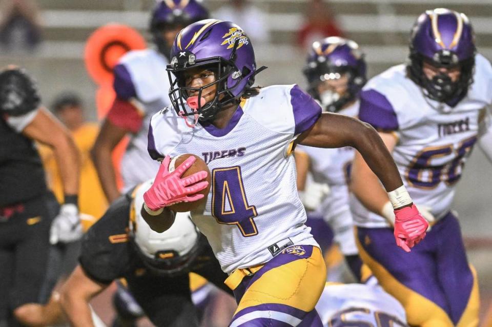 Lemoore’s Elijah Daley finds a lane during a run against Clovis West in their game at Veterans Memorial Stadium on Friday, Sept. 1, 2023.