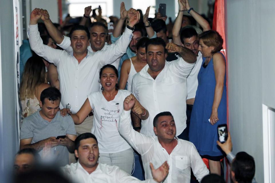 Supporters of Ekrem Imamoglu candidate of the secular opposition Republican People's Party celebrate at CHP offices in Istanbul, Sunday, June 23, 2019. Turkish government's candidate for Istanbul mayor concedes defeat after first results from rerun election are reported. (AP Photo/Lefteris Pitarakis)