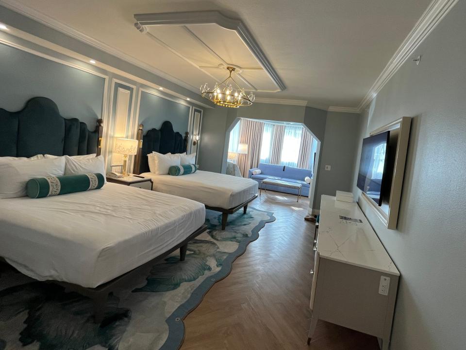 wide view of a standard 2 queen room at the grand floridian resort at disney world