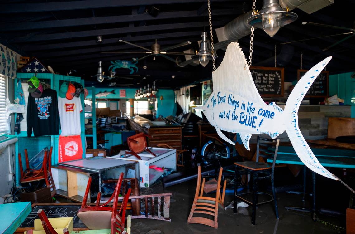 An inside view of the Blue Dog Bar & Grill restaurant on Thursday, Sept. 29, 2022, in Matlacha, Fla. Hurricane Ian made landfall on the coast of South West Florida as a category 4 storm Tuesday afternoon leaving areas affected with flooded streets, downed trees and scattered debris.