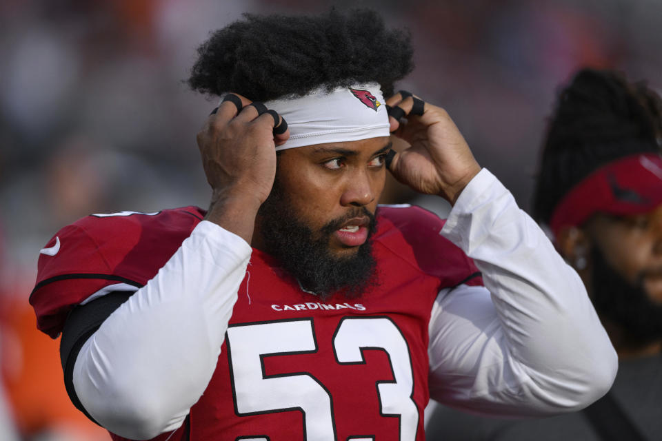 FILE - Then-Arizona Cardinals outside linebacker Jessie Lemonier (53) is shown on the sidelines before an NFL football game against the Cincinnati Bengals, Friday, Aug. 12, 2022, in Cincinnati. Outside linebacker Jessie Lemonier, who appeared in seven games for the Detroit Lions in 2021 in a brief NFL career highlighted by a sack of Aaron Rodgers of the Green Bay Packers, has died. He was 25. The Lions disclosed his death in a statement Thursday, Jan. 26, 2023, adding they confirmed it with his family. (AP Photo/Zach Bolinger, File)